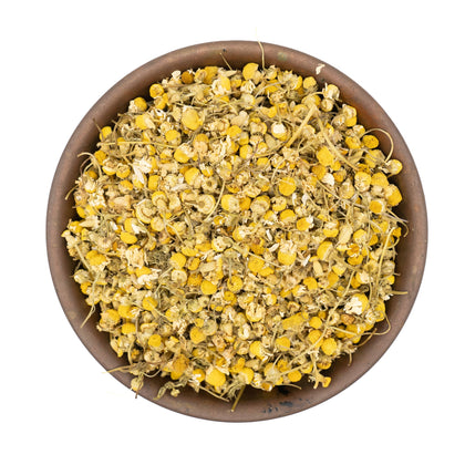Organic dried chamomile flowers for tea in a bowl