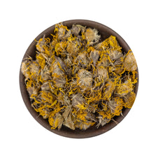 Dried arnica flowers in a bowl