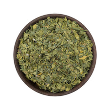 Dried cinnamon myrtle flakes in a bowl