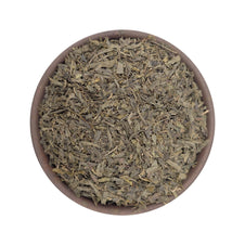 Dried sencha green tea leaves in a bowl